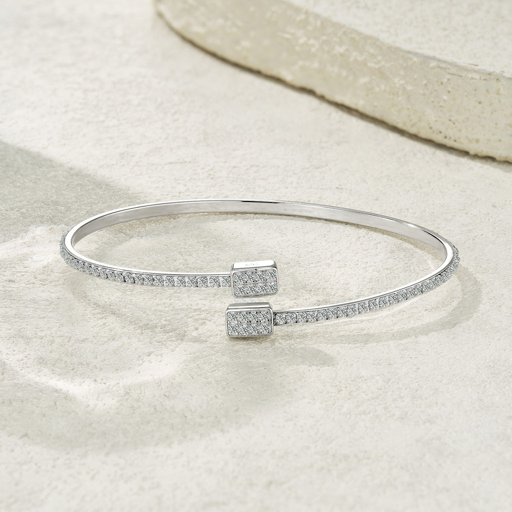 Elegant 925 sterling silver bangle in a minimalist design with moissanite
