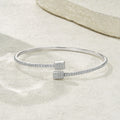 Elegant 925 sterling silver bangle in a minimalist design with moissanite