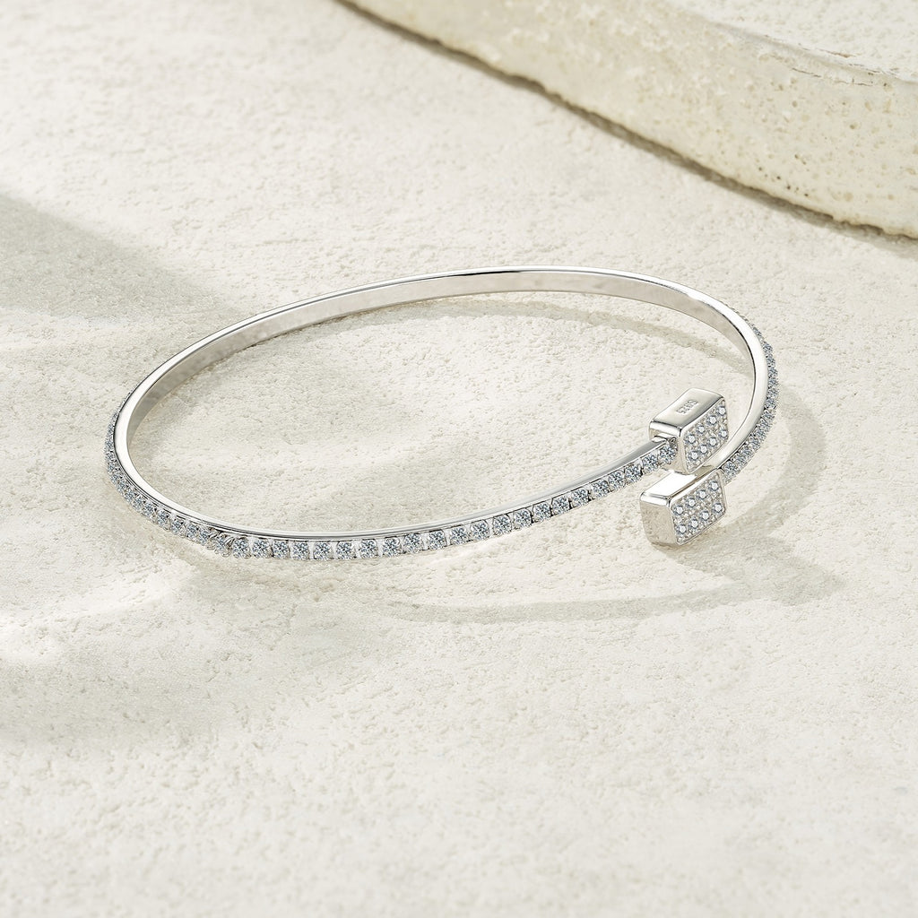 Elegant 925 sterling silver bangle in a minimalist design with moissanite